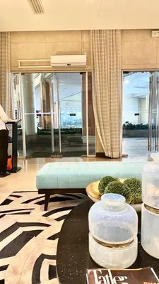 a lobby with a couch and a table in a building at 2 Bedrooms & 2 Bathrooms at BGC Taguig McKinley by Venice Grand Canal mall in Manila