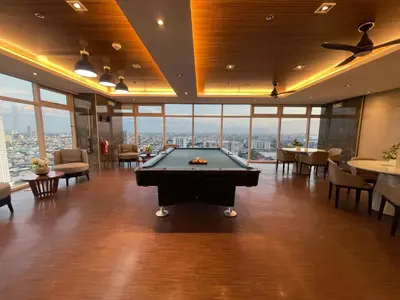 a pool table in a room with a view at Coast Residences Near MOA and NAIA Manila Bay View with Pool in Manila