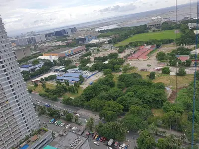 an aerial view of a city with the beach at SkyViewCondotel Breeze Residences Staycation near WTC,PICC,MOA,NAIA,OCEAN PARK in Manila