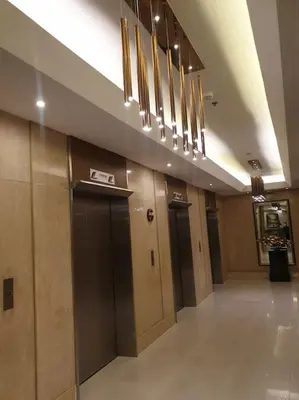 a row of elevators in a building with a hallway at SkyViewCondotel Breeze Residences Staycation near WTC,PICC,MOA,NAIA,OCEAN PARK in Manila