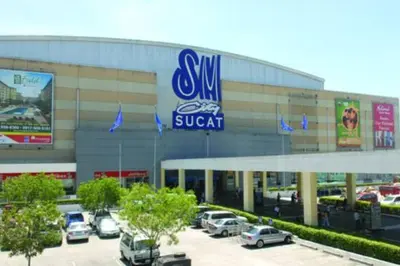 a swm suv dealership with cars parked in a parking lot at Near Manila Airport COZY 02 Bedroom Condo With Pool - 4R in Manila