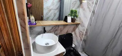a small bathroom with a sink and a toilet at Near Manila Airport COZY HOTEL STYLE Condo With Pool 7A in Manila