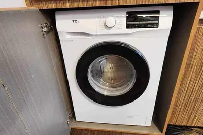 a washing machine in a shelf in a room at Near Manila Airport COZY HOTEL STYLE Condo With Pool 7A in Manila
