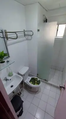 a white bathroom with a toilet and a sink at Near Manila Airport COZY 01 Bedroom Condo - 10K in Manila