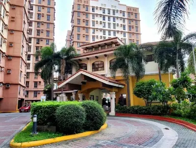 a building in a city with tall buildings at Near Manila Airport COZY Studio Condo With Kitchen 11P in Manila