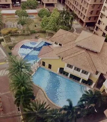 an overhead view of a swimming pool in a building at Near Manila Airport COZY Studio Condo With Kitchen 11P in Manila