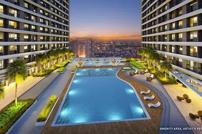 an aerial view of a building with a swimming pool at 1BR Condotel with Balcony at FAME Residences #FM55 in Manila