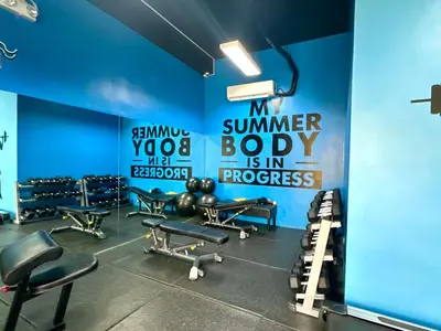 a gym with a sign that reads my summer body is in progress at Luna Hive Place in Malapandan