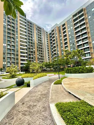 a walkway in front of some tall buildings at Luna Hive Place in Malapandan