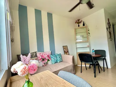 a living room with a couch and a table at Luna Hive Place in Malapandan