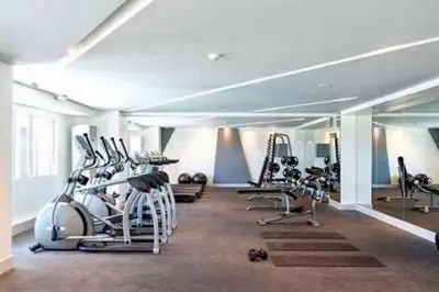 a gym with several treadms and machines in a room at 20th flr SMDC Lights Residence Mandaluyong City Philippines in Manila