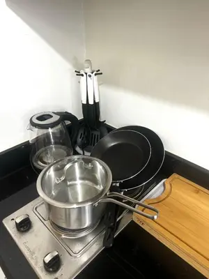 a pan sitting on top of a stove in a kitchen at Cloud Place Shore 2 Residences in Manila