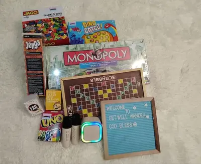 a pile of games and other items on a floor at Azure staycationbyGetwellwander in Manila