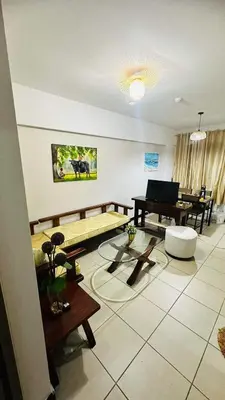 a living room with a table and a piano at Resort-Style 2BR Condo at Alea DMCI Family Staycation in Manila