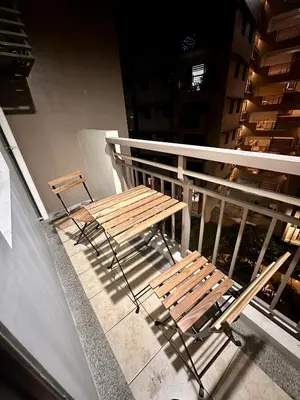 a bench sitting on top of a balcony at Resort-Style 2BR Condo at Alea DMCI Family Staycation in Manila