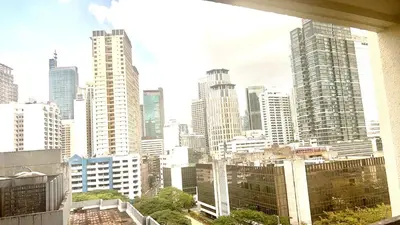 a view of a city skyline with tall buildings at 9D Standard Room staycation in Manila