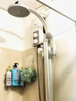 a shower in a bathroom with a shower at That Boho Crib 1bedroom with Balcony facing amenities in Manila