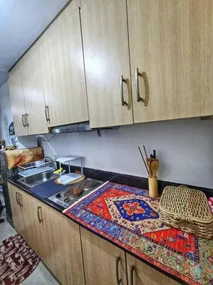 a kitchen with a counter with a rug on it at That Boho Crib 1bedroom with Balcony facing amenities in Manila