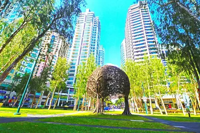 a sculpture in a park in a city with tall buildings at BGC High Rise, Uptown Mall Link, 5G WiFi, Pool, Ste 29 in Manila