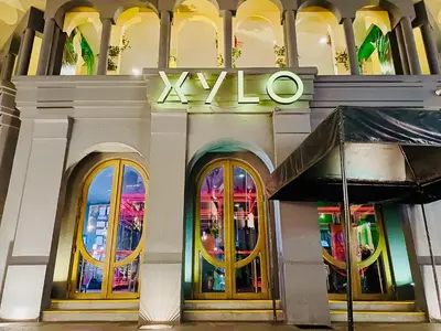 a building with a xlvo sign on it at BGC High Rise, Uptown Mall Link, 5G WiFi, Pool, Ste 29 in Manila
