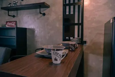 a counter with two cups on top of it at Comfy and Cozy Retreat in Manila with a Stunning View in Manila