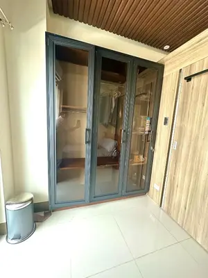 a sliding glass door in a room with a room at Casa ni Yanyan at Fame Residences in Manila