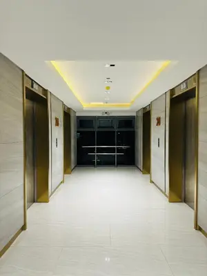 a hallway with elevators in a building at Casa ni Yanyan at Fame Residences in Manila