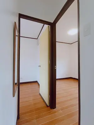 an empty room with a door and a mirror at JeSa's Serenity Sanctuary in Dasmariñas