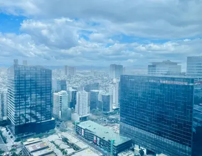 an aerial view of a city with tall buildings at One Uptown Residence BGC in Manila