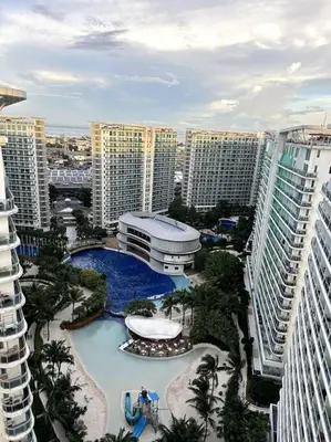 an aerial view of a resort with tall buildings at El Spacio Azure 1BR with PS4 & Netflix in Manila
