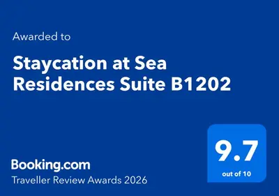 a blue sign that reads vacation at sea reserves suite at Staycation at Sea Residences Suite B1202 in Manila