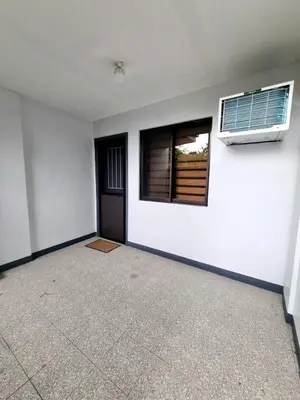 an empty room with a door and a window at Flat 35, Unit 1E in Manila