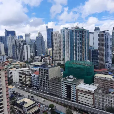 a view of a city with many tall buildings at Quaint Aparthotel T22306 in Manila