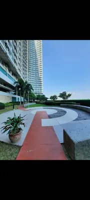 a walkway in the middle of a city at Quaint Aparthotel T22306 in Manila