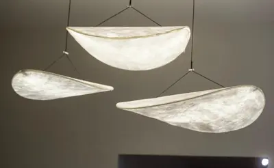 two pieces of paper hanging from a ceiling at Sarannya Home BGC in Manila