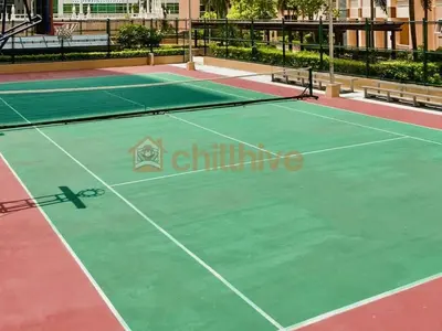 a tennis court with two tennis courts at Stylish 1BR Venice Mall, Pool, Fast WiFi #vlrtc17e in Manila