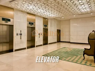 a lobby with a elevator in a building at Stylish 1BR Venice Mall, Pool, Fast WiFi #vlrtc17e in Manila