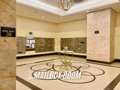 a lobby with a small table in a mall bathroom at Stylish 1BR Venice Mall, Pool, Fast WiFi #vlrtc17e in Manila