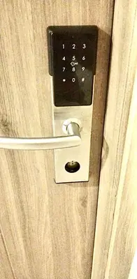 a door with a lock on a door with a door at Cosy Deluxe Flat with Balcony near MOA in Manila