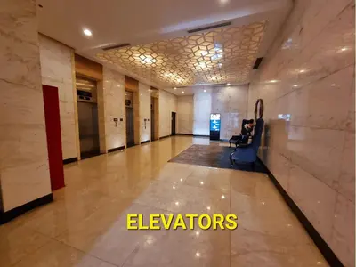 a hallway of a building with a lobby with elevators at BGC Luxury, Venice Grand Canal Mall #vlrtc27c in Manila