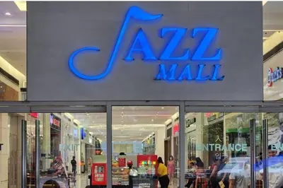 a mall with a sign on the front of it at Homey 2br Apt 5 in Makati City in Manila