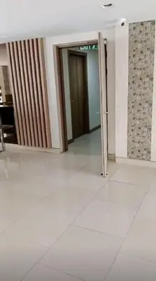 an empty hallway with a door in a building at Modern & Cozy Space near NAIA Terminal 1 in Manila