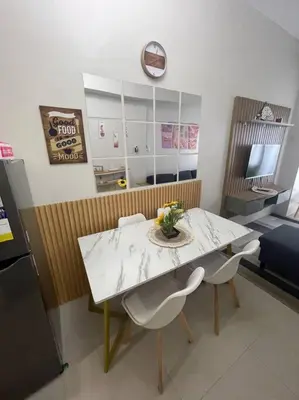 a dining room with a table and two chairs at Modern & Cozy Space near NAIA Terminal 1 in Manila