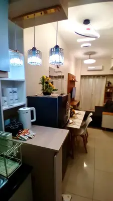 a kitchen with several lights hanging from the ceiling at Modern & Cozy Space near NAIA Terminal 1 in Manila