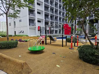 a playground with a swing set in a park at Lourdes' Place, Shore 2-Tower 1, 2 Beds, Pasay near Mall of Asia in Manila