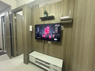 a flat screen tv on the wall of a hospital room at 2BR Coast Residences in Manila