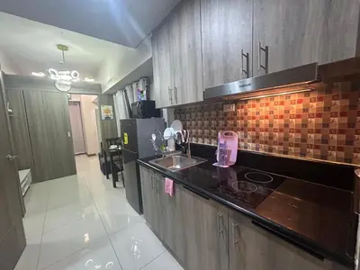 a kitchen with a sink and a counter top at 2BR Coast Residences in Manila