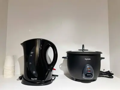 a coffee maker and a toaster on a counter at The W Place in Manila