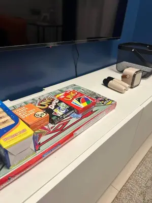 a white table with books on top of it at The W Place in Manila