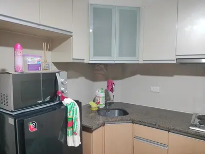 a kitchen with a sink and a microwave at ROOM NEAR AIRPORT BY RQUi in Manila